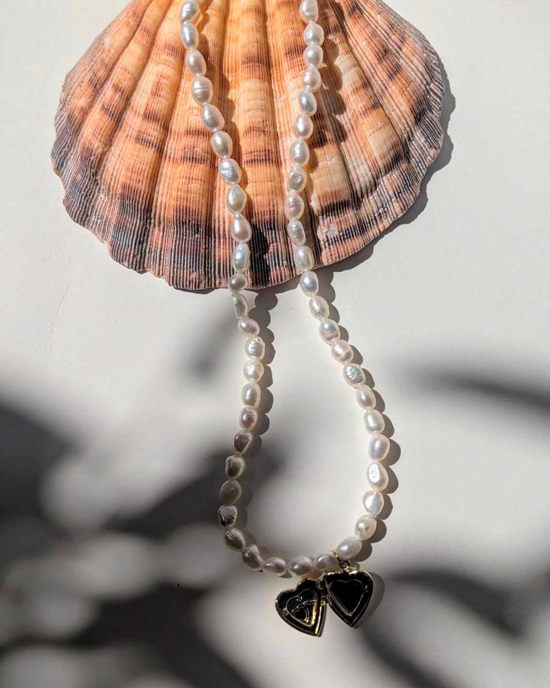 pearl necklace with heart locket charm