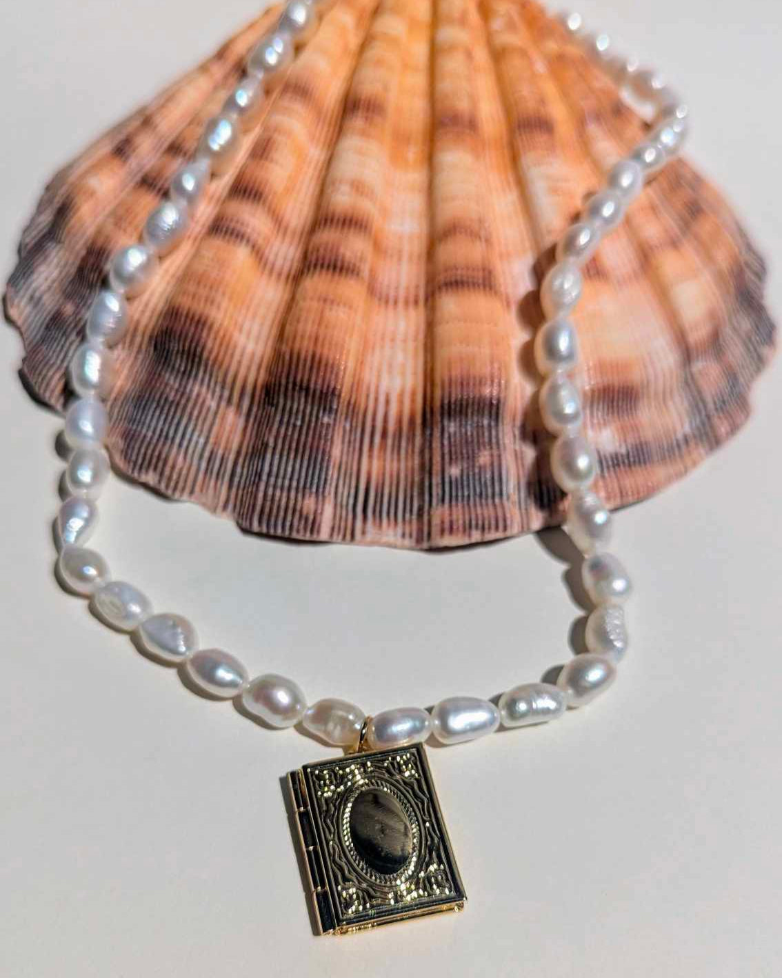 pearl necklace with book locket charm