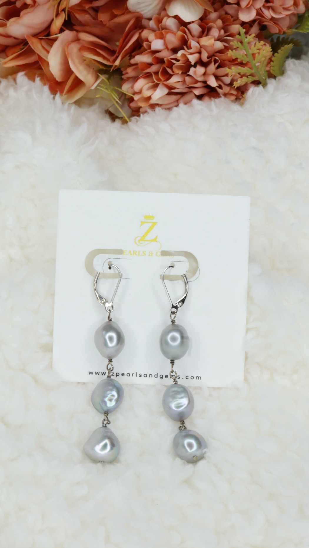 Long dangling pearl earrings