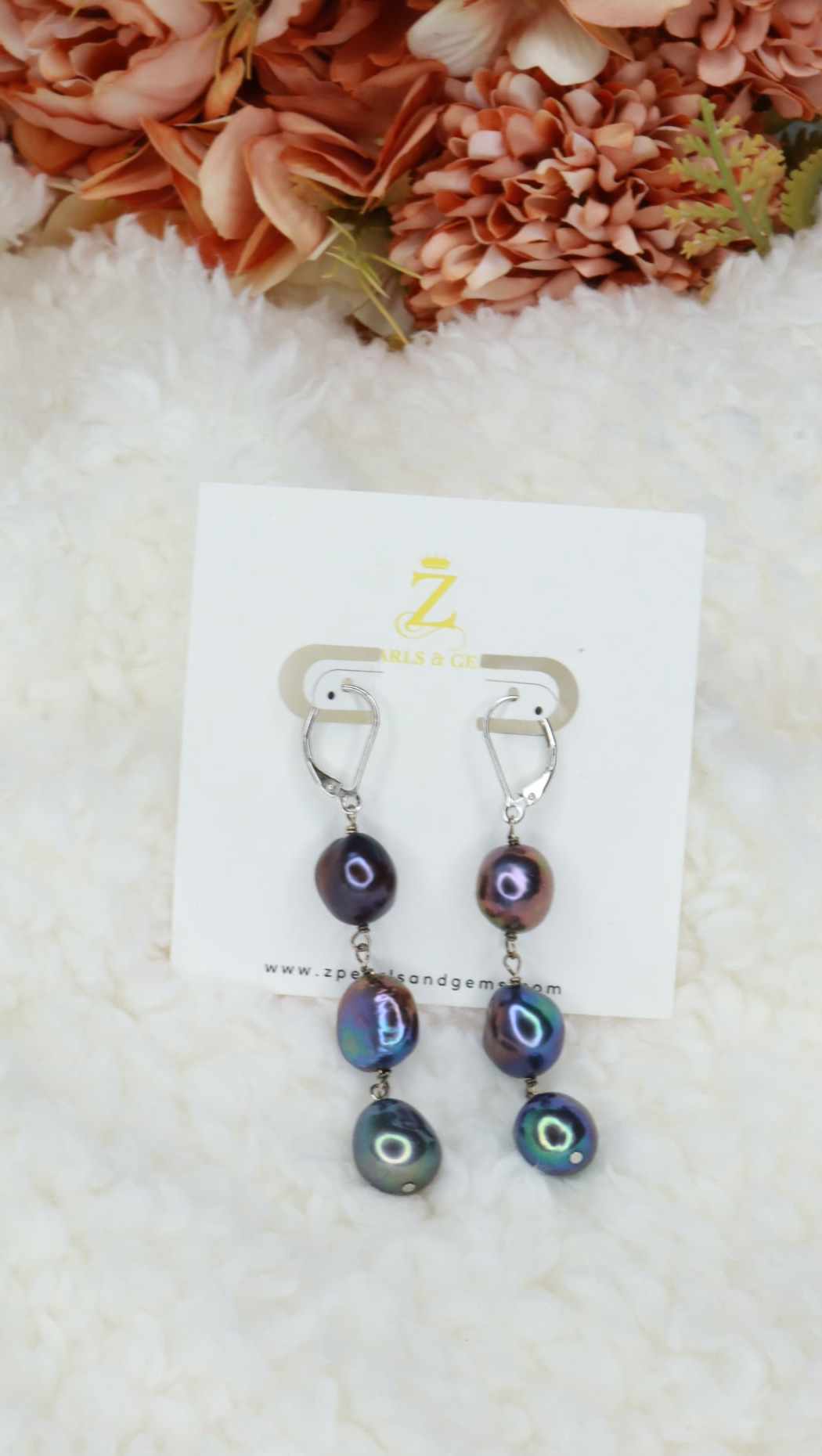 Long dangling pearl earrings