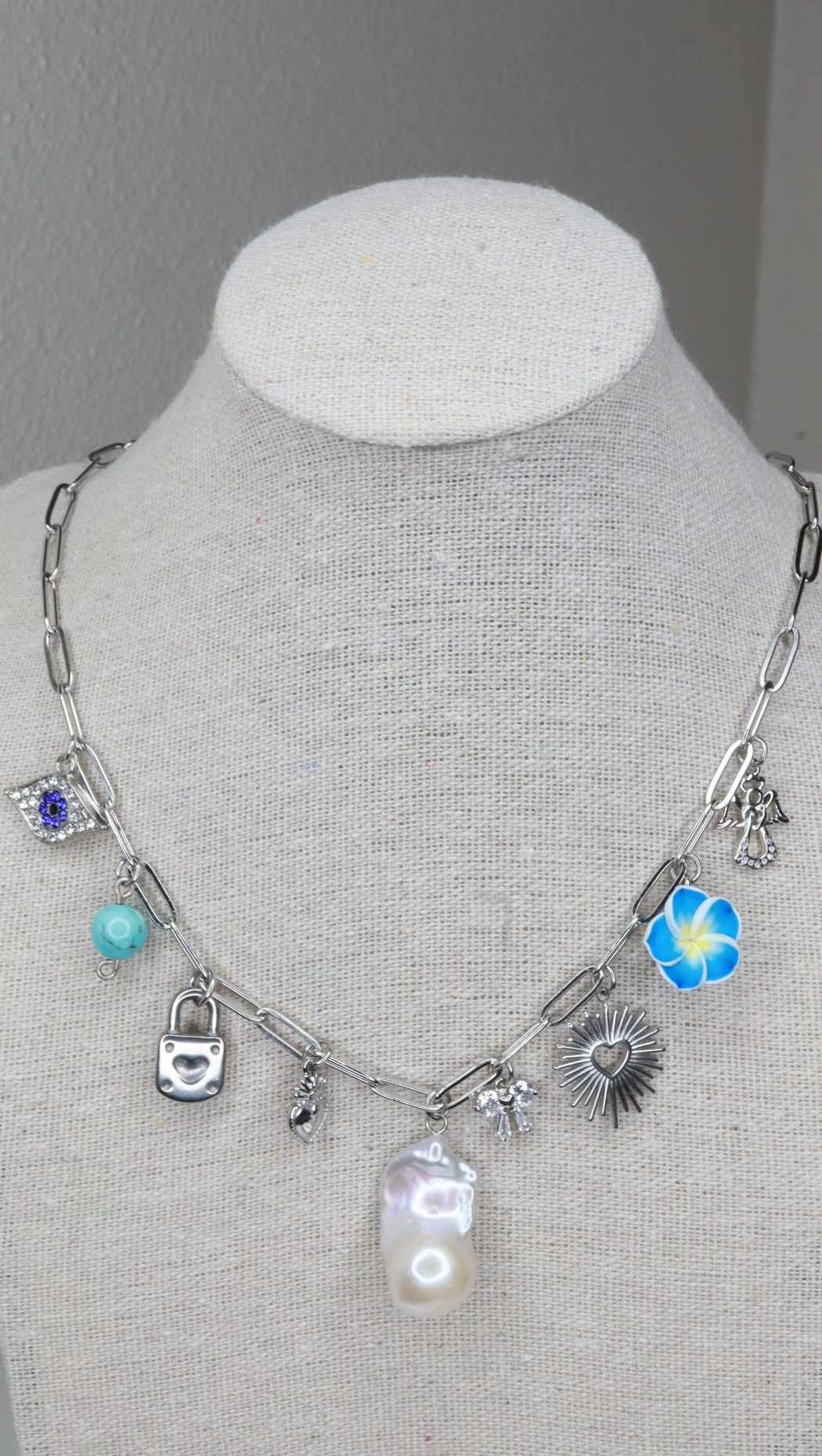 Blue and silver charm necklace with baroque pearl
