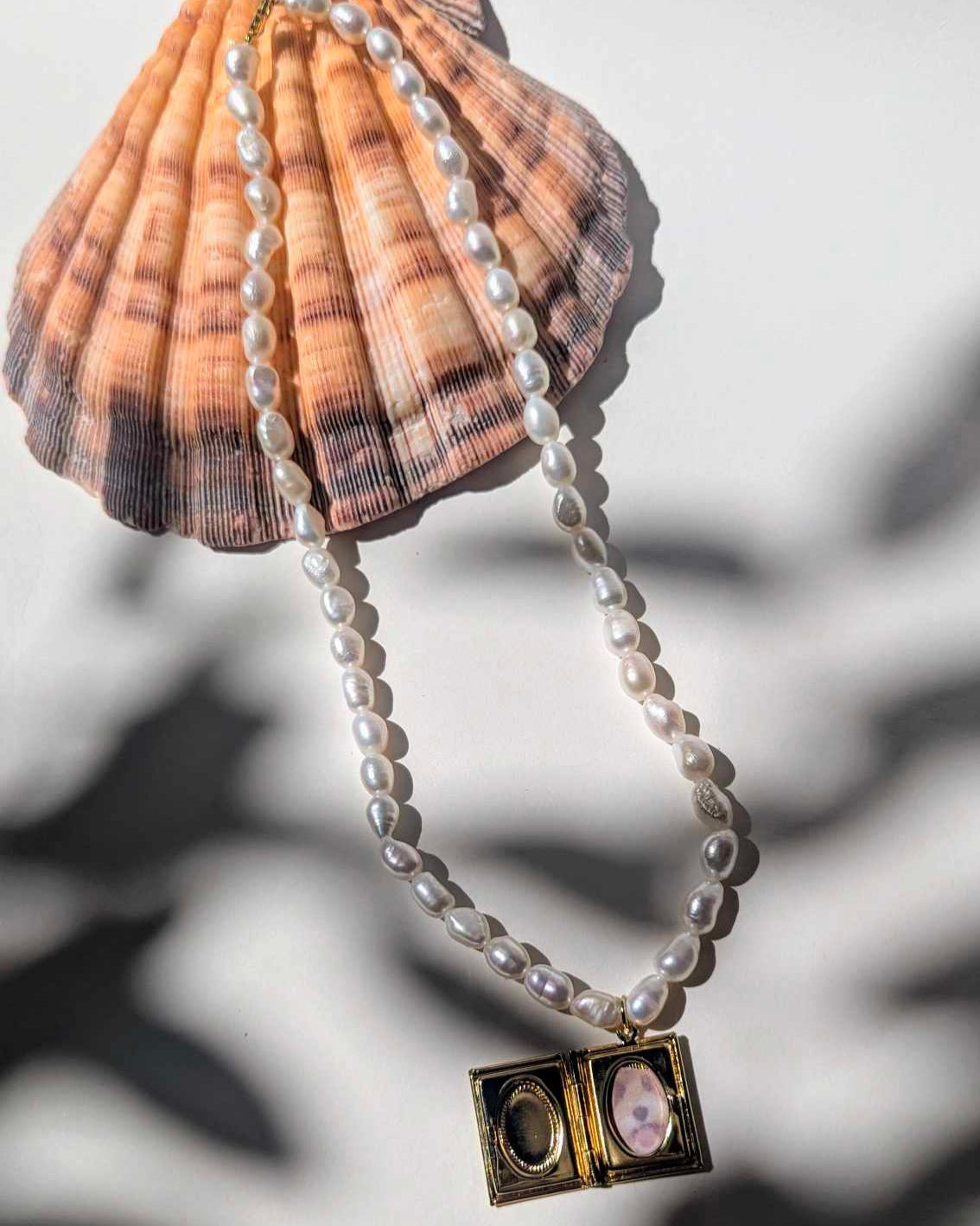 pearl necklace with book locket charm